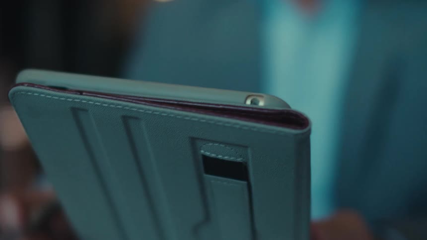 A man thinks as he uses his tablet
