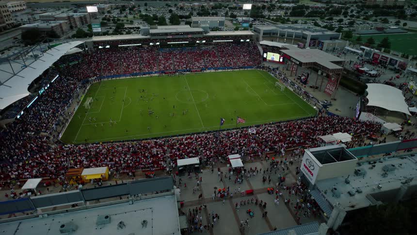 Aerial view of a sports stadium packed with fans