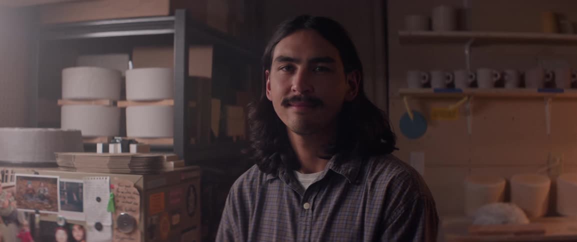 Portrait of a smiling man in his garage workshop