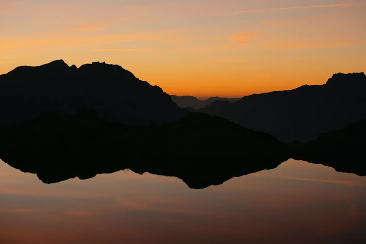 The mountain is reflecting on the lake water