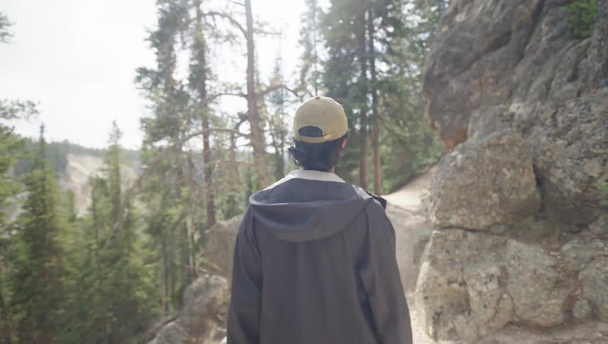 A man is hiking on the cliff