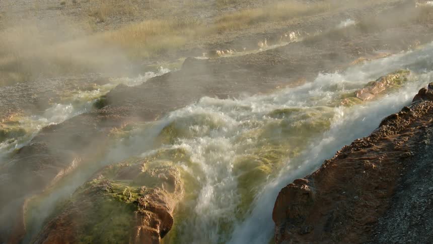 Mist rises from the running stream