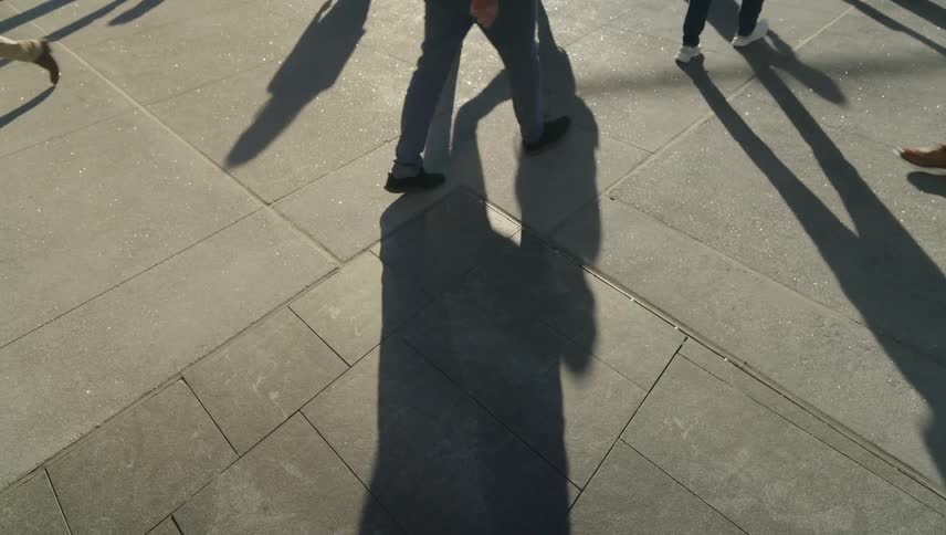Pedestrians walking on a city sidewalk