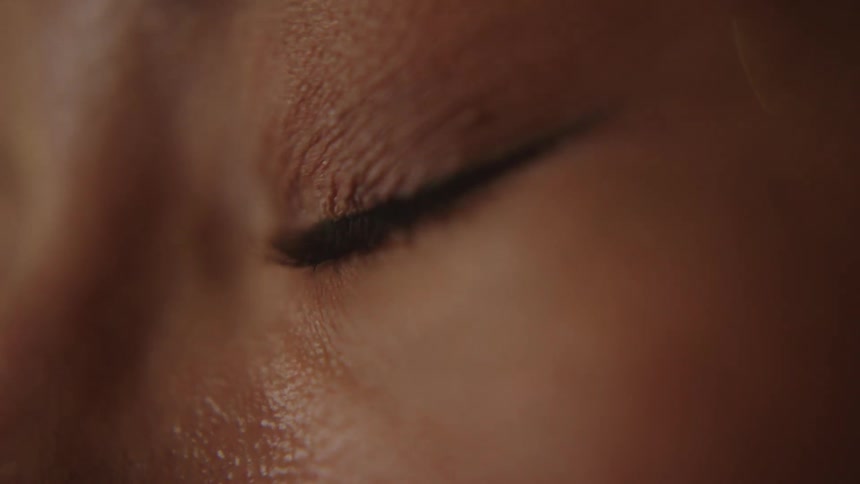 A woman is blinking her eye