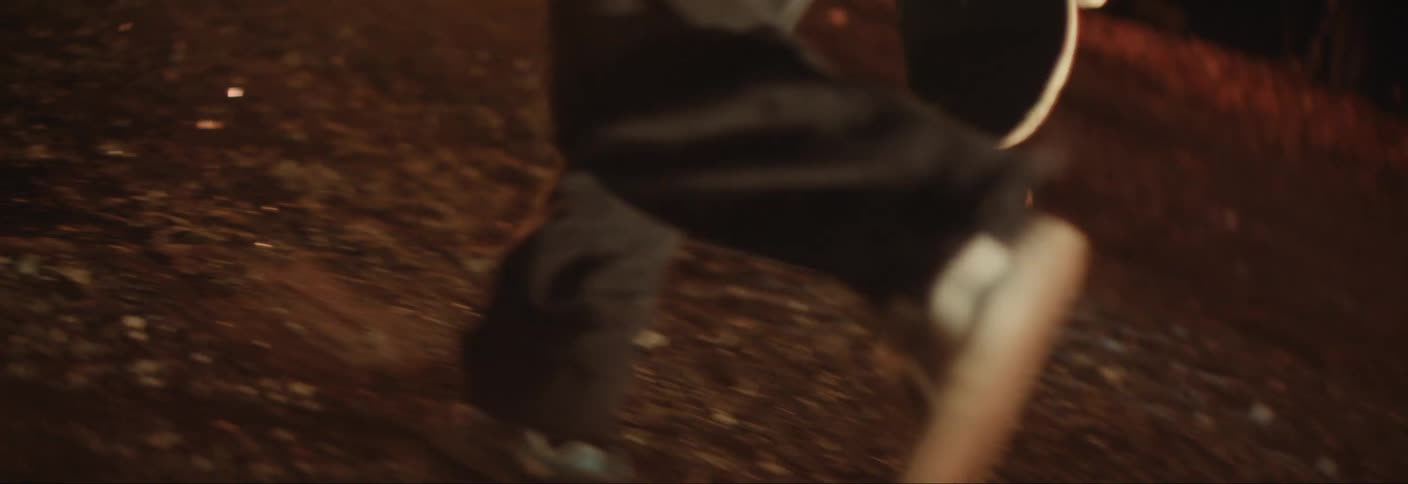Legs of two people running outdoors