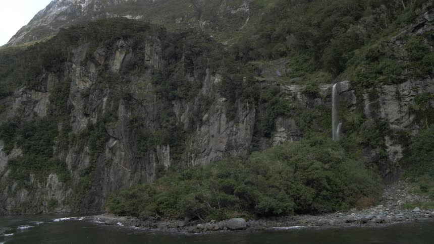 A waterfall cascades over a cliff