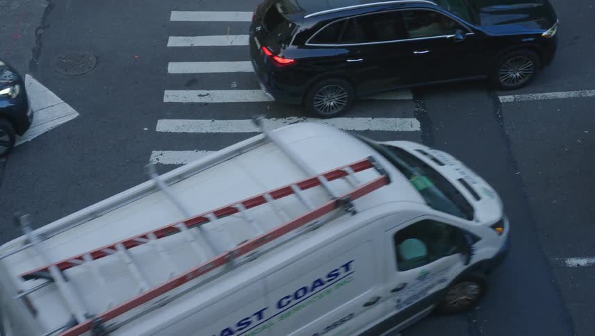 Traffic makes a turn on the crosswalk