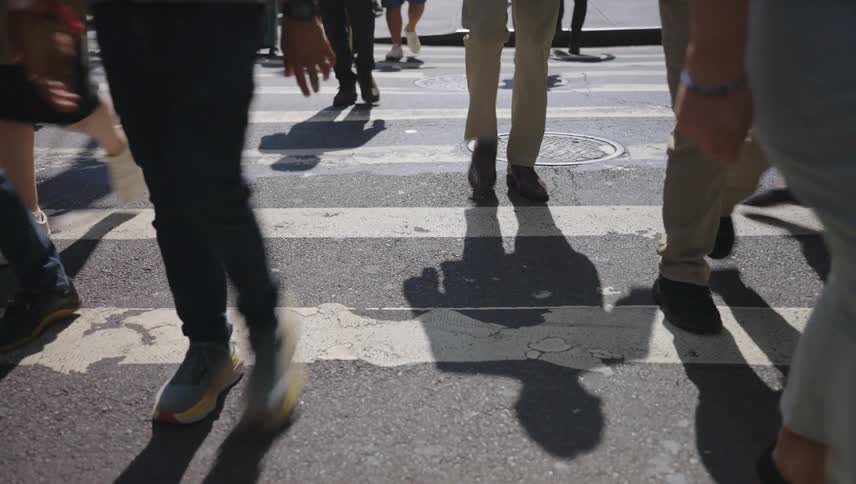 People crossing a pedestrian crossing