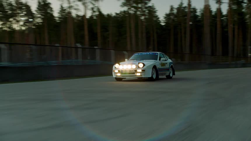 A car races by on the track
