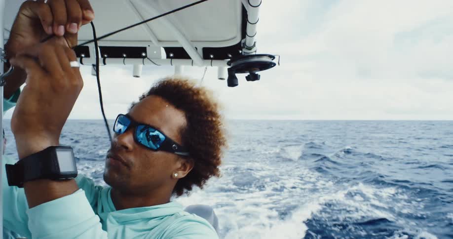 A man ties a rope on the boat