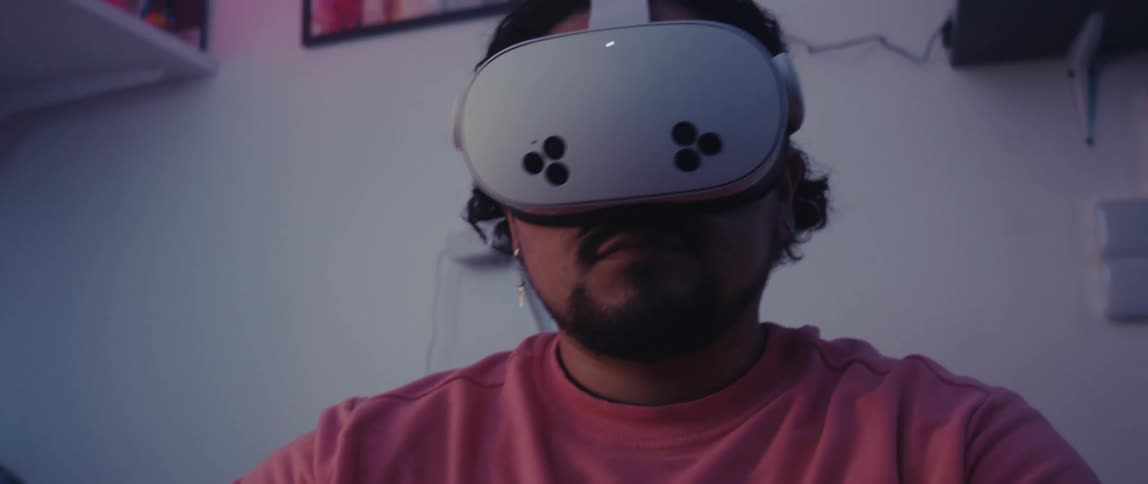 A man reaches around while using virtual reality