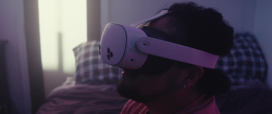 Man sitting in a room using a vr headset