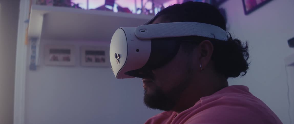 Man in a room using a vr headset while sitting