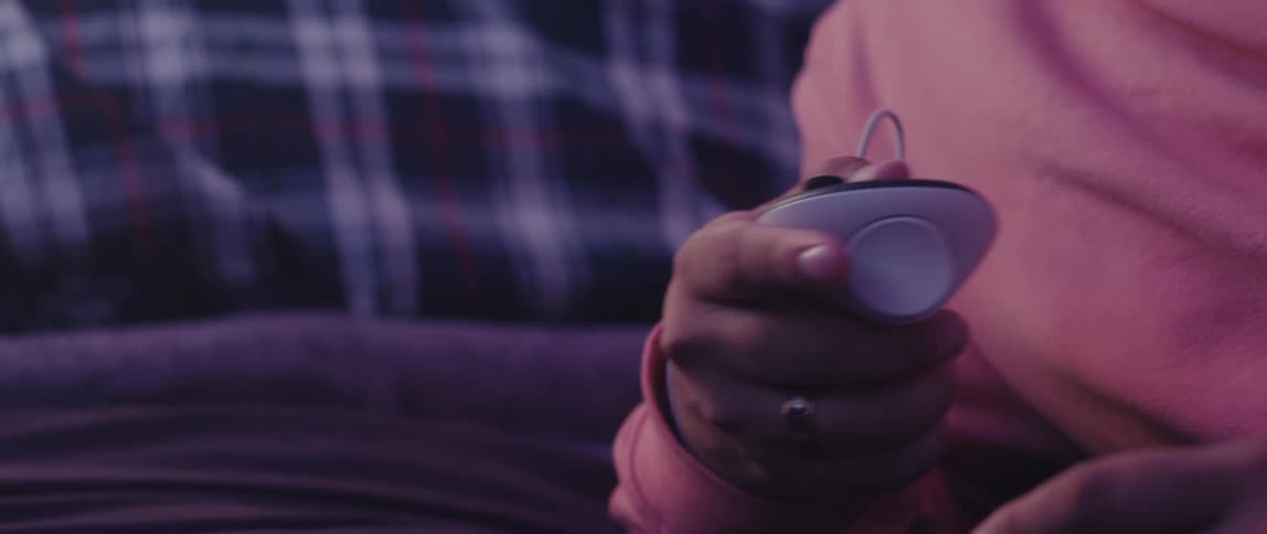 Hand holding a wired controller