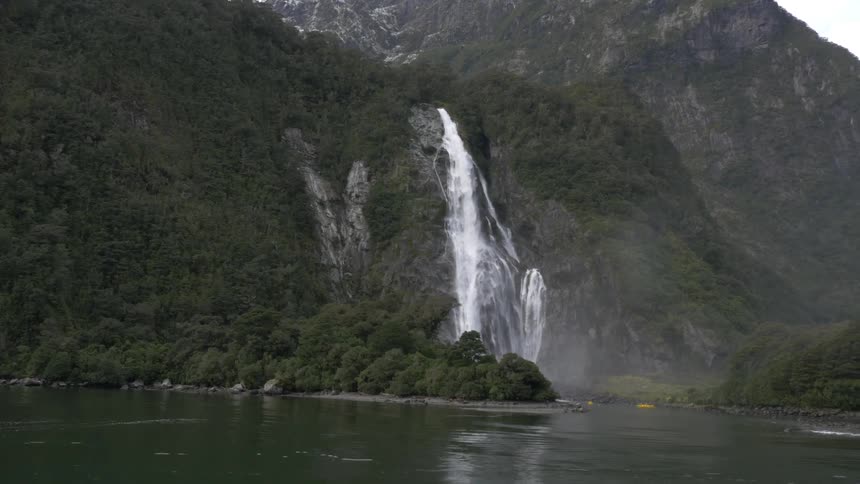 A waterfall cascades over a cliff