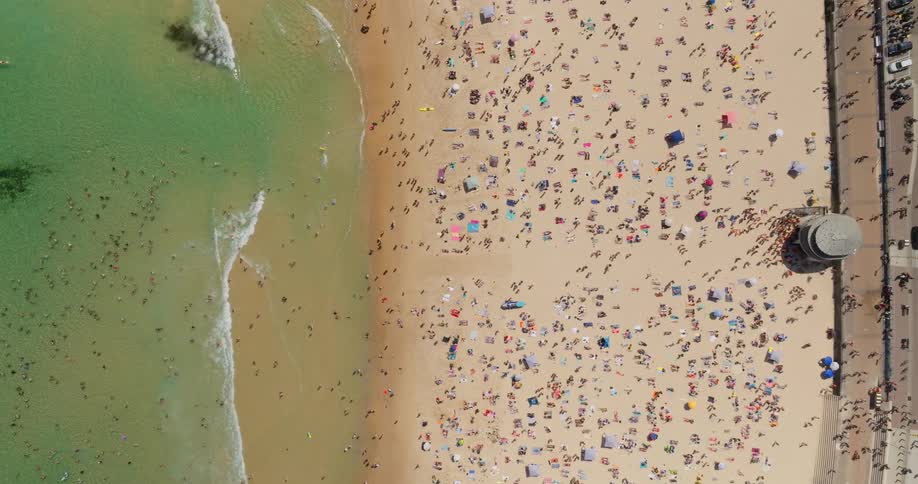 Aerial view of a crowd of people enjoying a beach