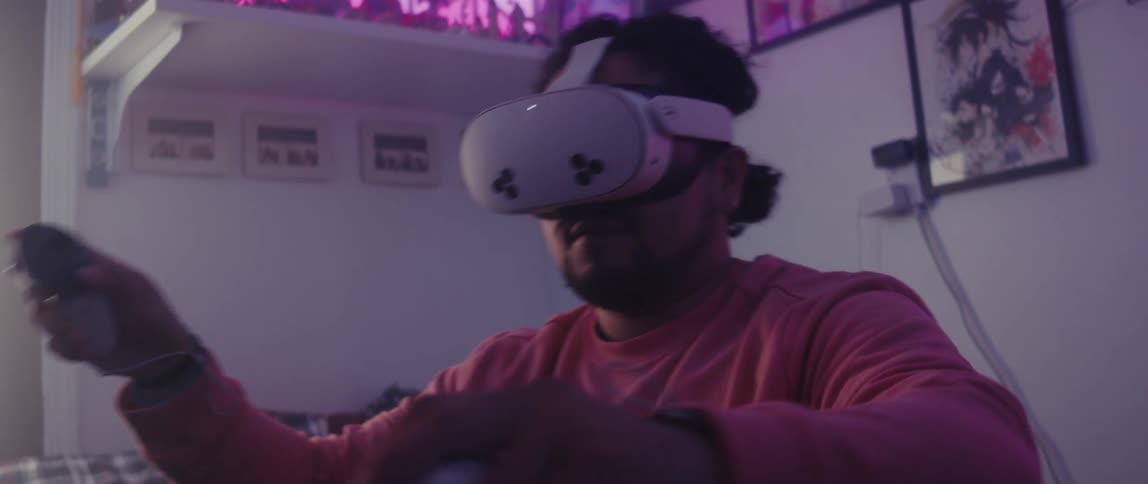 A man is using a virtual reality headset