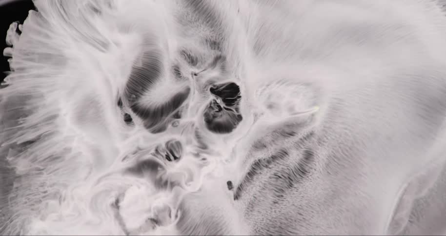 Extreme close up of an abstract bubbling dense liquid