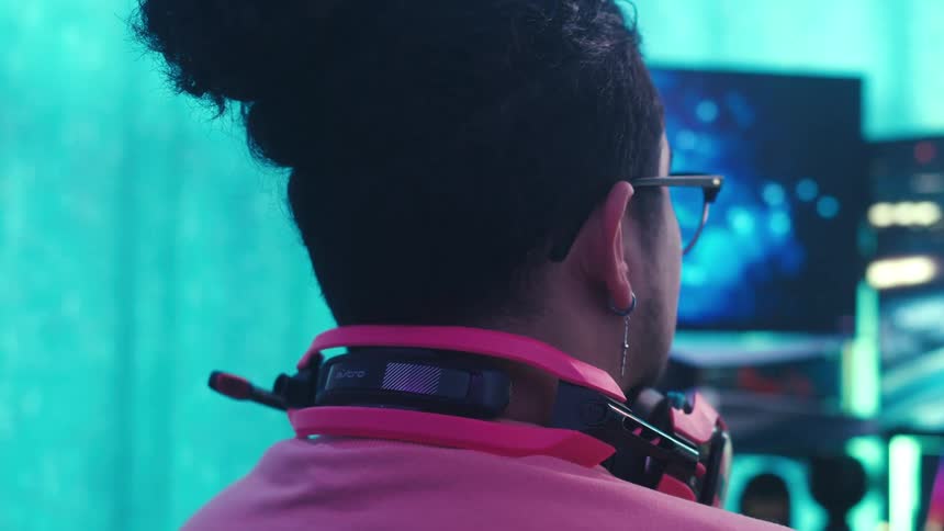 Man sitting in front of a computer playing