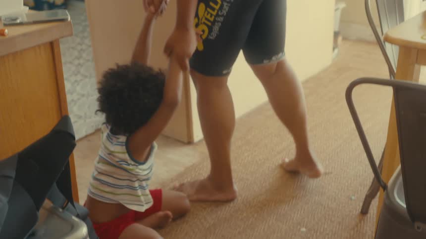 A mother puts down her son at home