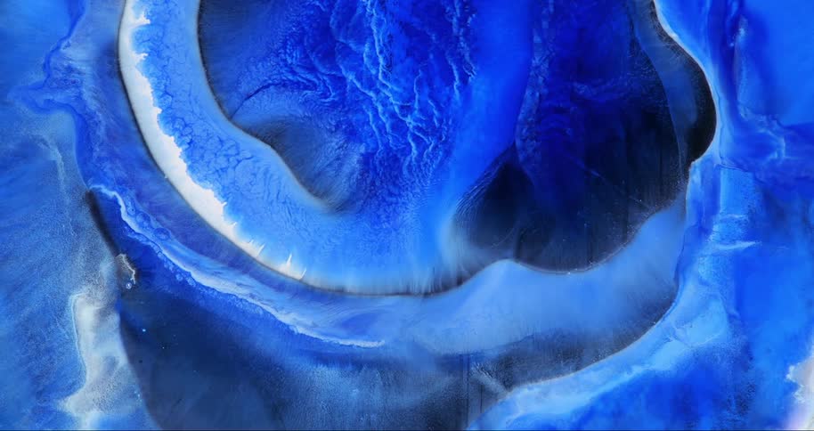 A swirling mass of deep blue hues creates an abstract ethereal pattern