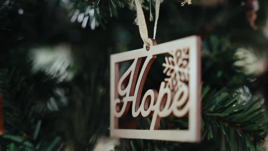 A close up clip of a pendant decoration on a tree