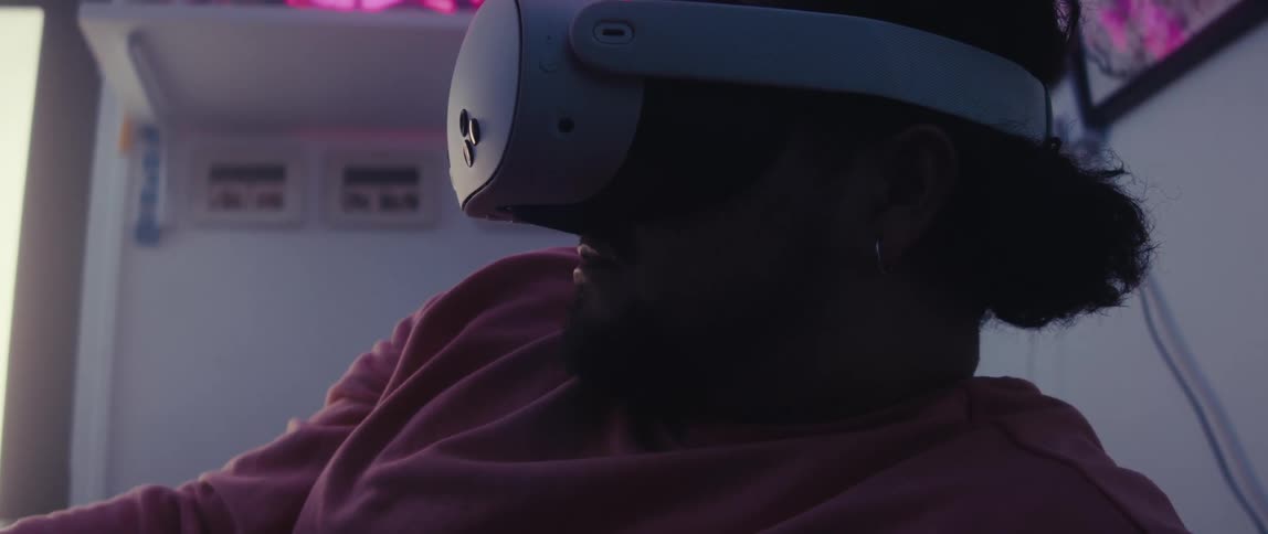 Man in a room using a white vr headset