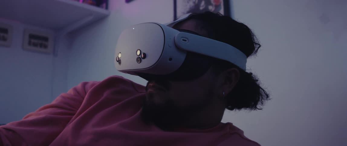 Man in a room using a white vr headset