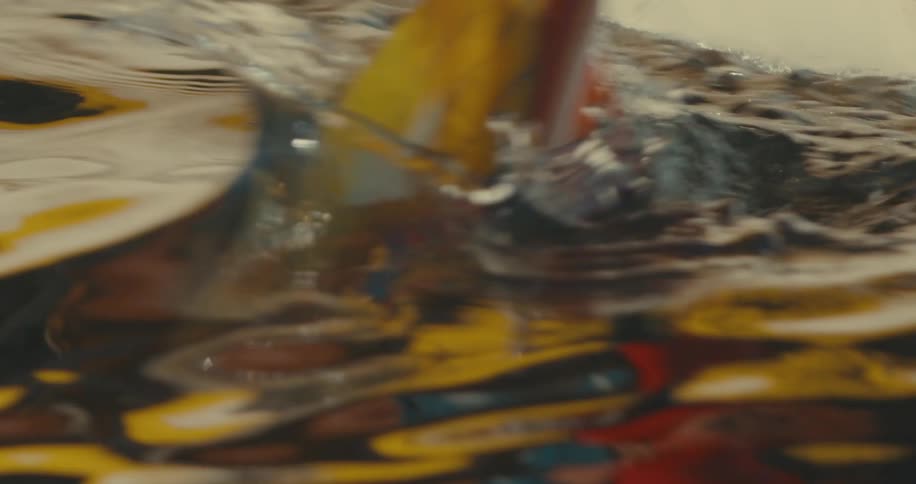 Closeup of a kayaking oar moving through a body of water