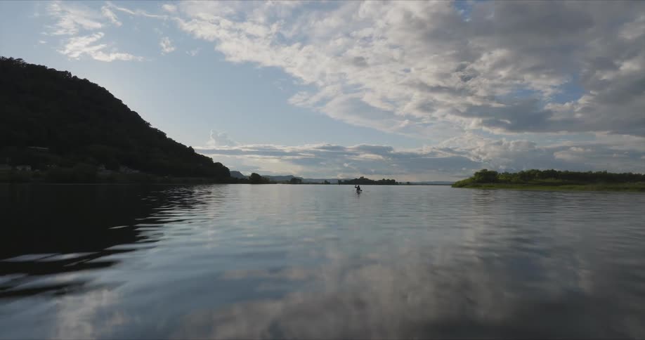 Person canoeing down a river