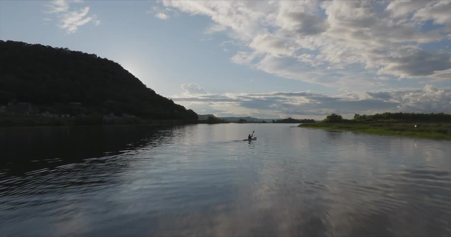 Person canoeing on a river