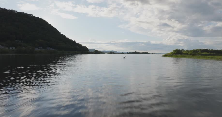 Person isolated on a river canoeing