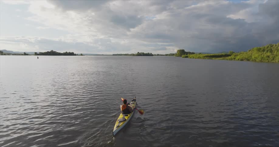 Person canoeing on a river