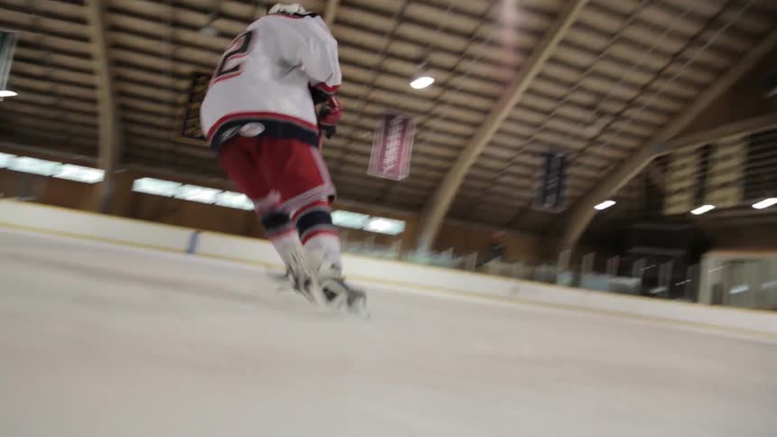A man practices playing ice hockey