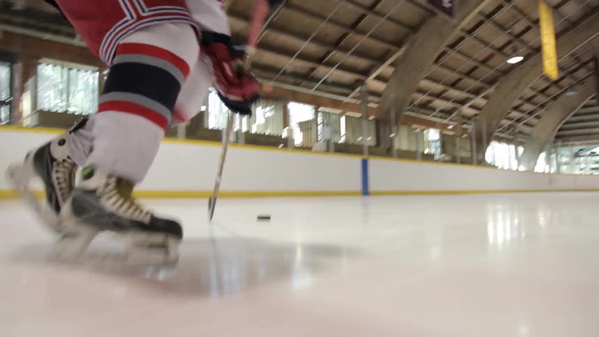 A man practices playing ice hockey