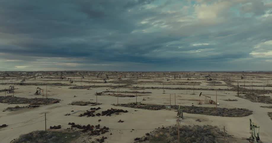 Aerial view of a desert region with destruction and a cloudy sky