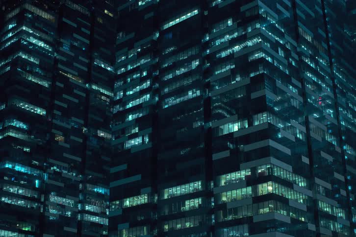Lights flicker on and off in city skyscrapers