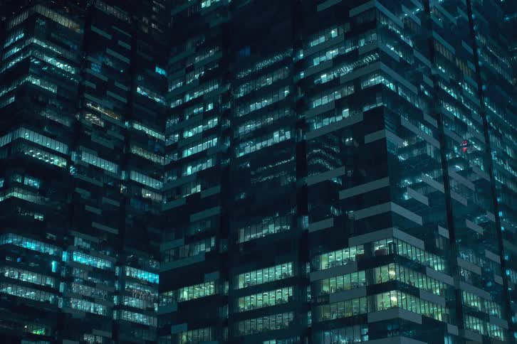 Lights blink and flash in the buildings at night