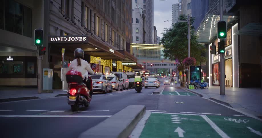 People drive down the big city street