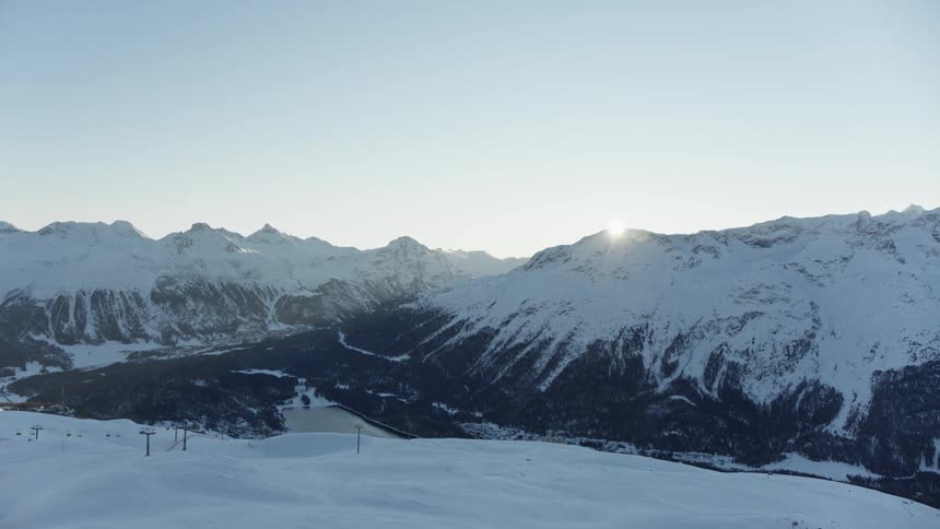 Panorama of mountains with a sunset on the horizon