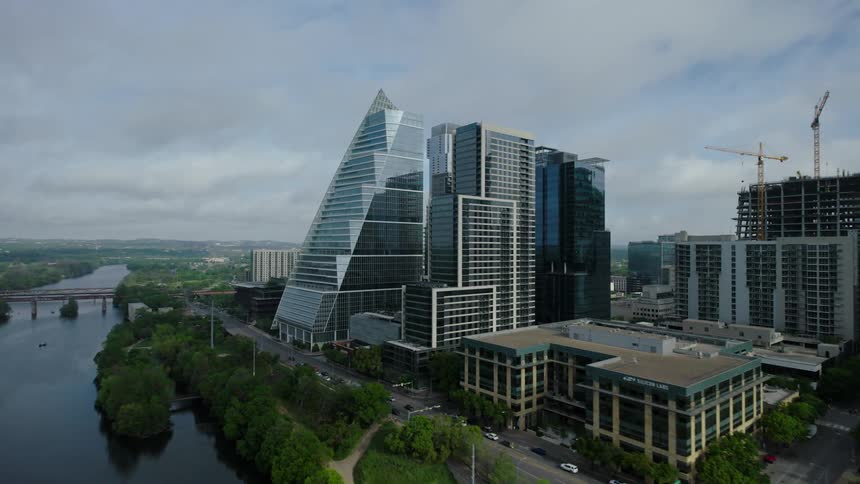 Modern mirrored buildings on the edge of a sea canal in a metropolis