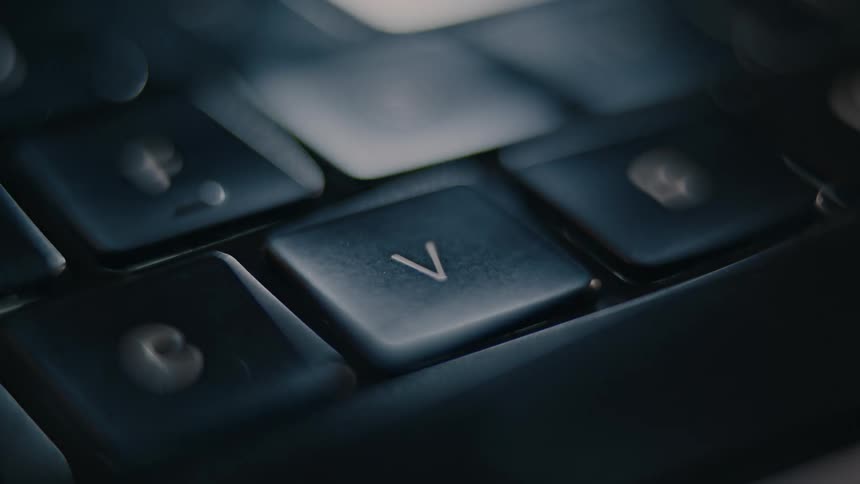 Finger clicking a laptop key