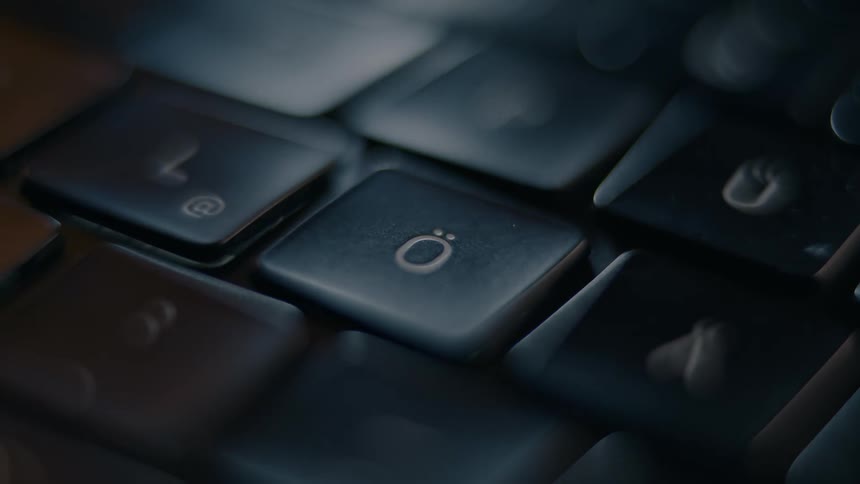 A finger pressing the okey on a keyboard
