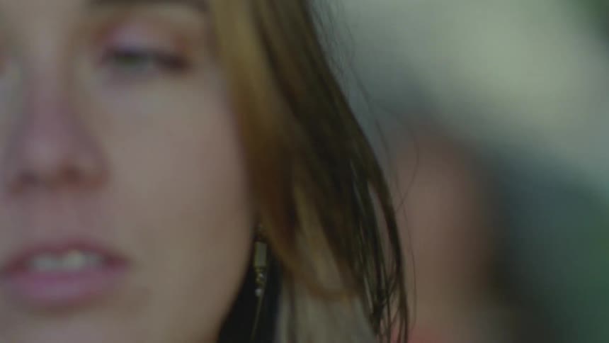 Portrait of a discouraged woman and another woman in the background