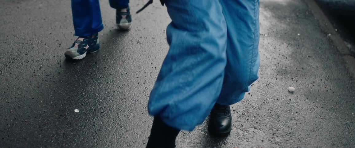 Two young women walking and dancing