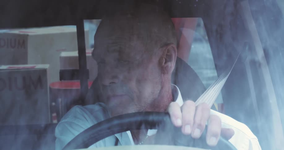 Portrait of a man driving a car