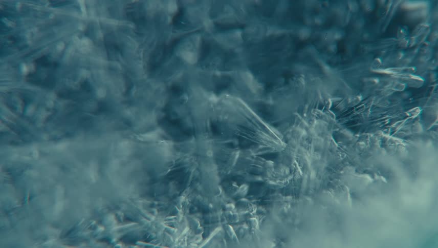 A closeup of frosting its icy surface displaying intricate frost patterns