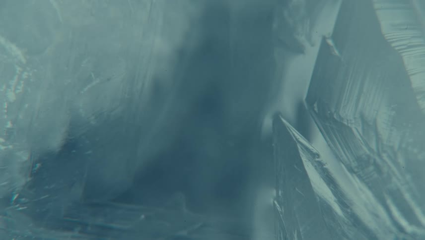 A closeup of frosting its icy surface displaying intricate frost patterns