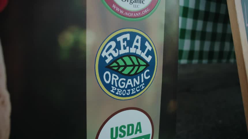 Close up of a billboard with organic certification labels