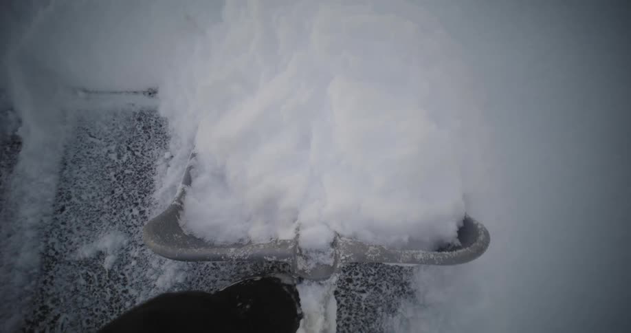 A person is shoveling snow with a shovel